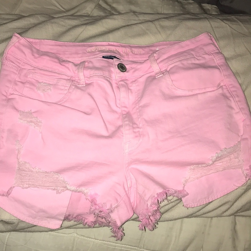 Pink distressed shorts